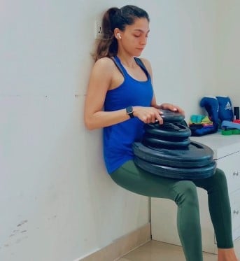 Amina Sibtain while working out at her home