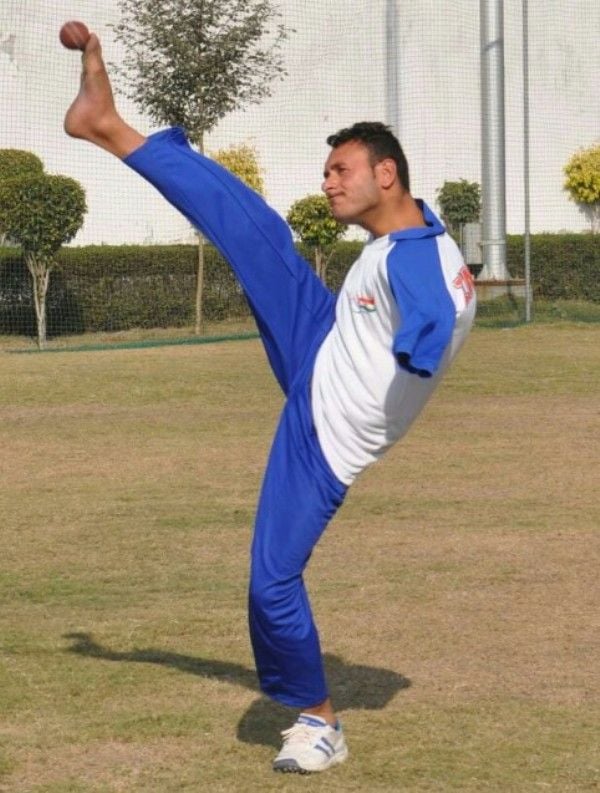 Amir Hussain Lone bowling in a match