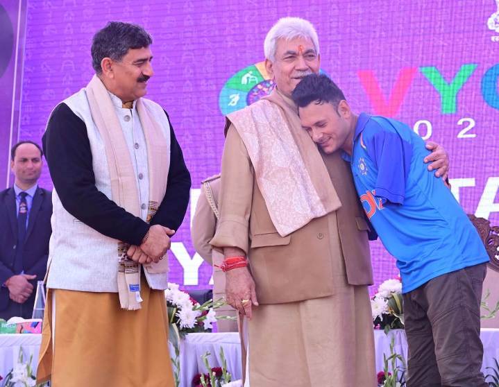 Amir Hussain Lone (right) with Manoj Sinha (centre), the 2nd Lieutenant Governor of Jammu and Kashmir, when he was employed by RAMKY Infrastructure