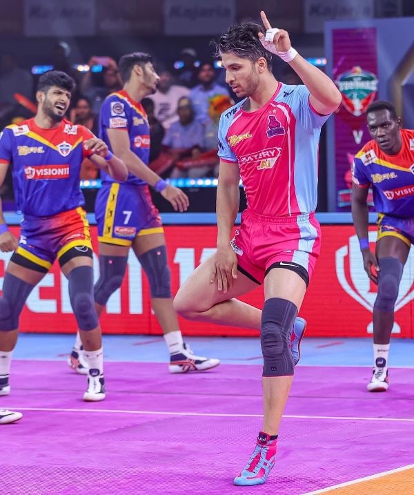 Amirhossein Mohammad Maleki after earning a raid point in a match against UP Yoddhas in PKL season 10