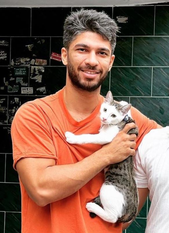 Amirhossein Mohammad Maleki holding a cat
