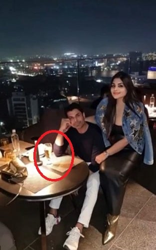 Amit Gaur in a restaurant with his wife