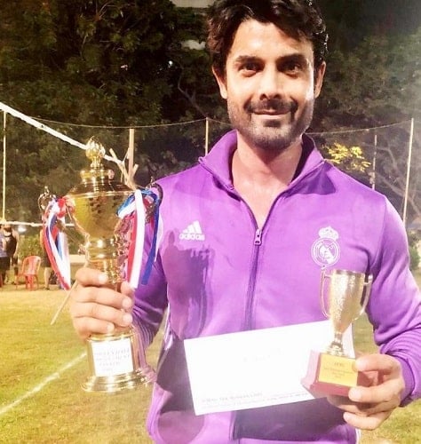 Amit Gaur with his volleyball trophies