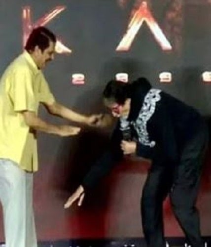 Amitabh Bachchan touching C. Aswani Dutt