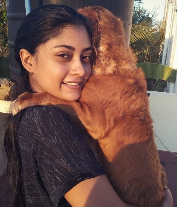 Ammu Abhirami with a dog