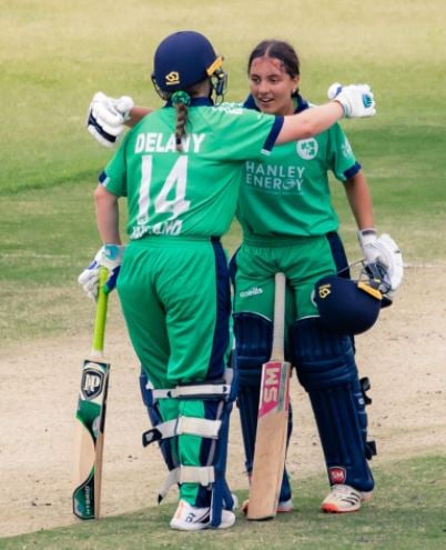 Amy Hunter acknowledged by her partner after scoring the century