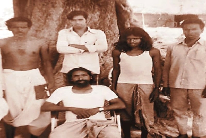 An old photo of Shibu Soren (seated) taken when he met the members of a tribe