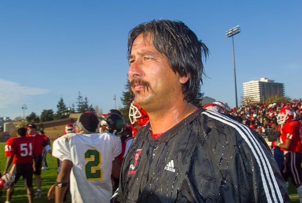 An old picture of John Beam during a football match