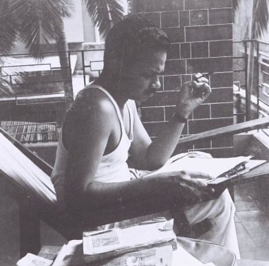 An old picture of M. T. Vasudevan Nair while writing