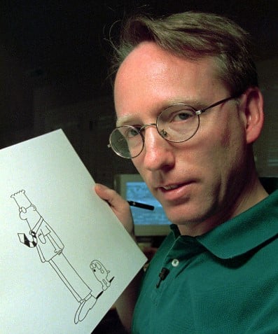 A young Scott Adams showing his cartoon characters