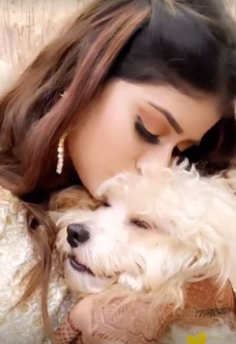 Anam Darbar with her pet dog