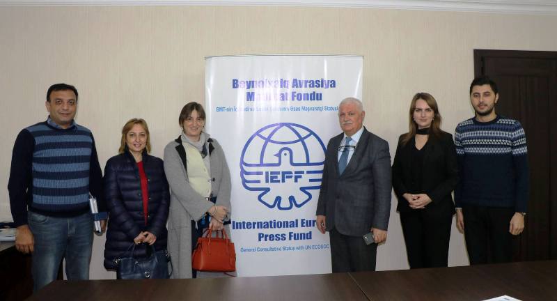 Anastasia Lavrina (centre, on the right), along with her team at the International Eurasia Press Fund (IEPF)