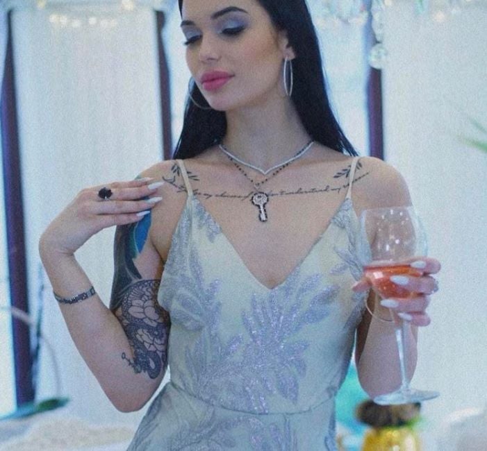 Andjela Tasheva holding a glass of wine