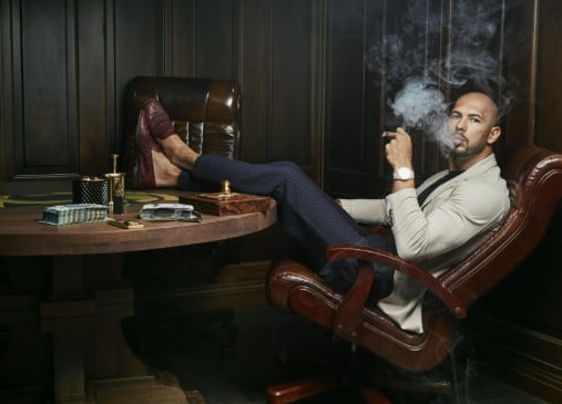 Andrew Tate while smoking a cigar