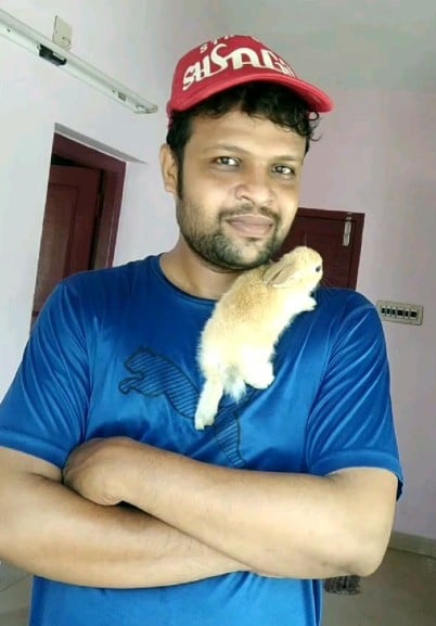 Aneesh Tharayil with his pet rabbit