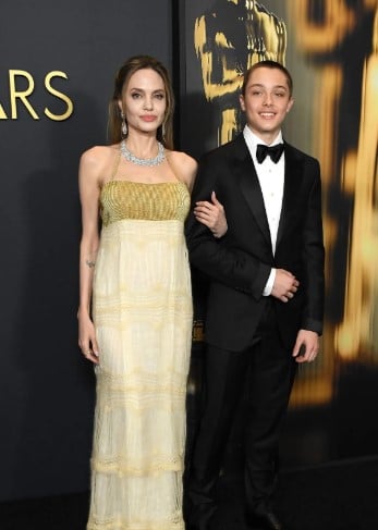 Angelina Jolie and Knox Jolie-Pitt attend the 2024 Governors Awards at Dolby Theatre in November 2024 in Hollywood, California