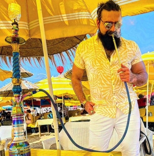 Aniket Chouhan smoking a hukka