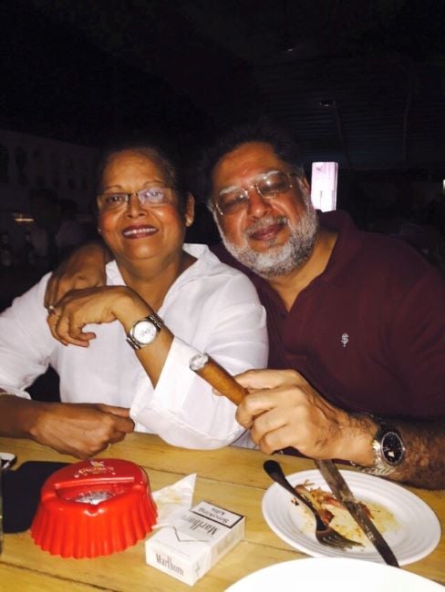 Anil Arora holding a cigar
