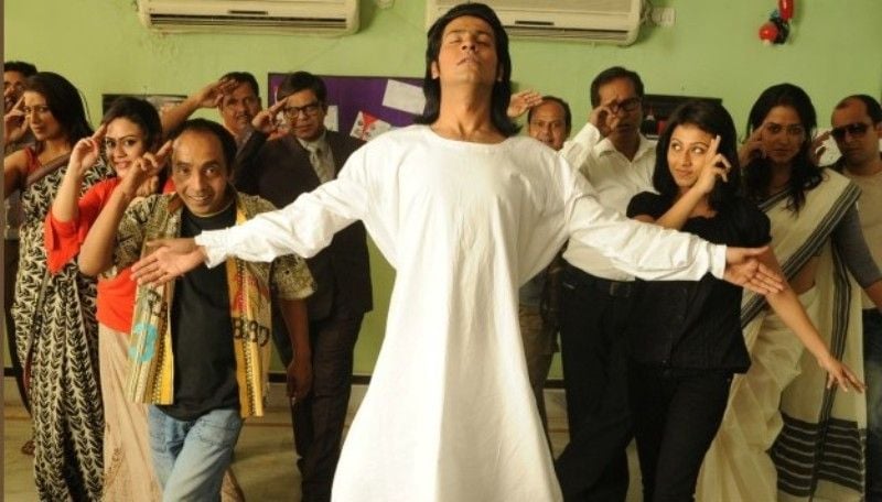 Anirban Bhattacharya (centre) as Judhajit Sarkar in a still from the Bengali film Kolkatar King