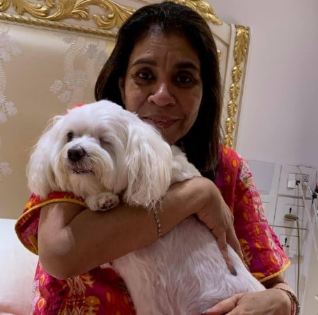 Anita Goyal posing with her pet