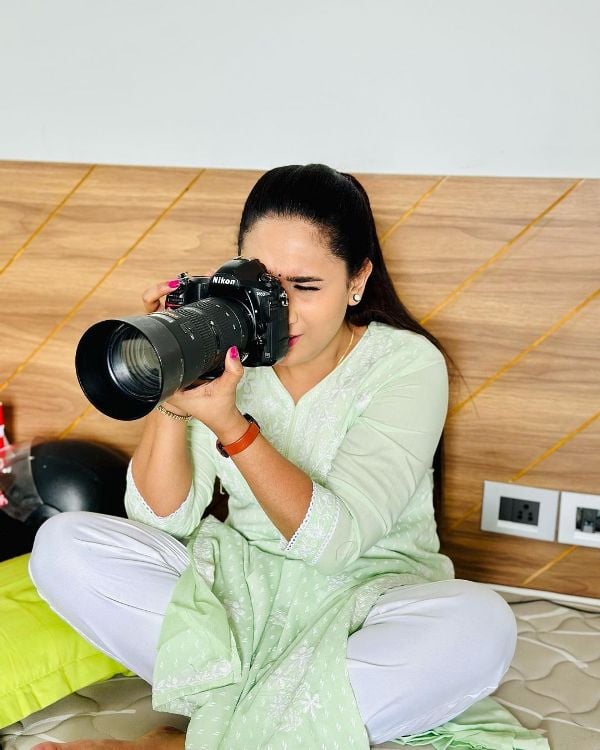 Anjali Ameer while holding a camera