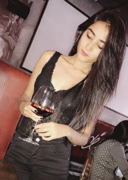 Anjali Krishna while enjoying an alcoholic beverage