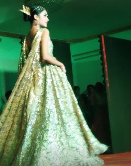 Anjali Krishna while walking the ramp at a fashion show