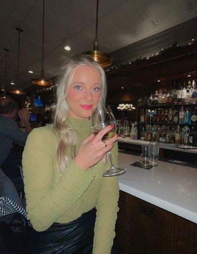 Annabelle Ham enjoying her drink at a bar