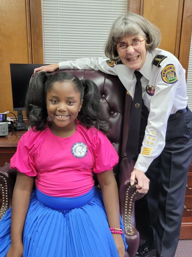 Anne Kirkpatrick at New Orleans Police Department with a kid