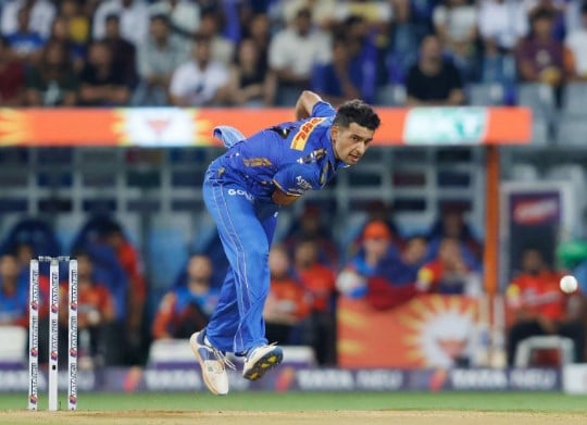 Anshul Kamboj while bowling in an IPL match in 2024