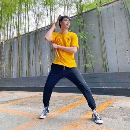 Anthony Jennings practising with nunchucks