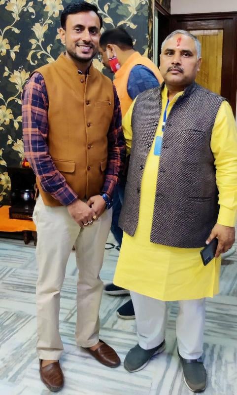 Anuj Chaudhary (left) during a political program