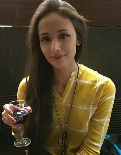 Anupriya Kapoor with a glass of wine