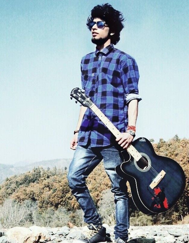 Anurag Dobhal with his guitar