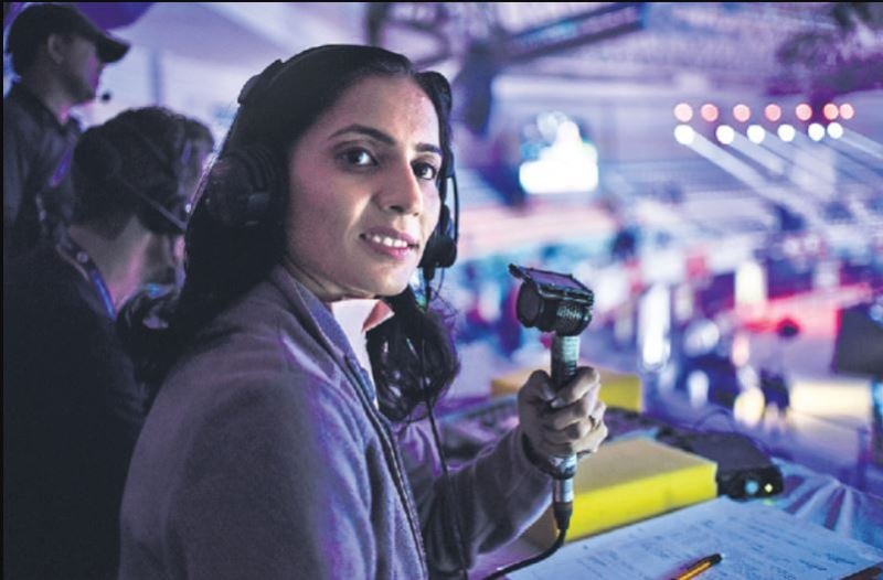 Aparna Popat commentating in a badminton match