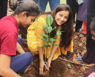 Apurva Nemlekar while planting a sapling
