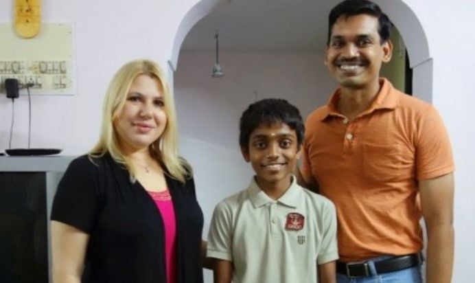 Aravindh Chithambaram (middle) with GM Susan Polgar and coach GM RB Ramesh