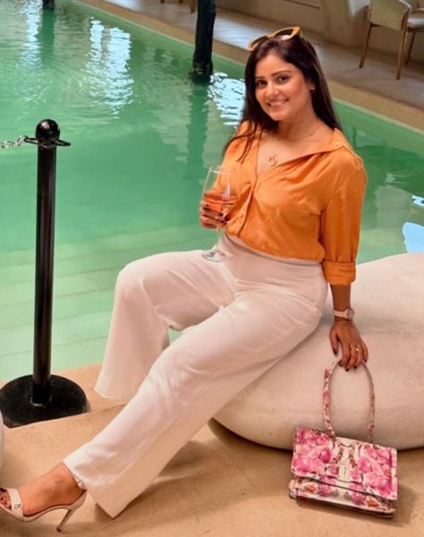 Archana Gupta drinking wine