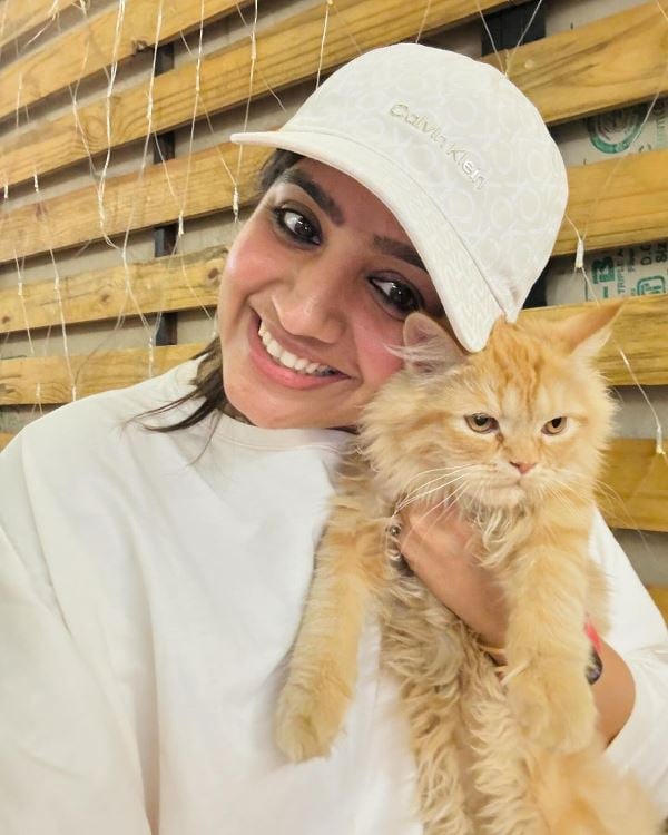 Archana Makwana while playing with her cat