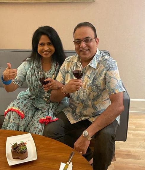 Arindam Sil holding a glass of wine