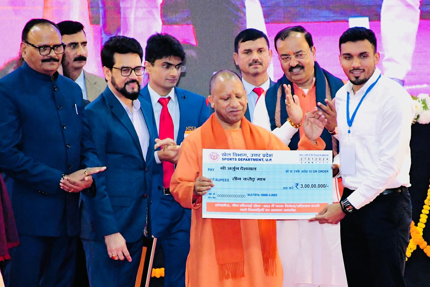 Arjun Deshwal receiving a reward worth Rs 3 crores