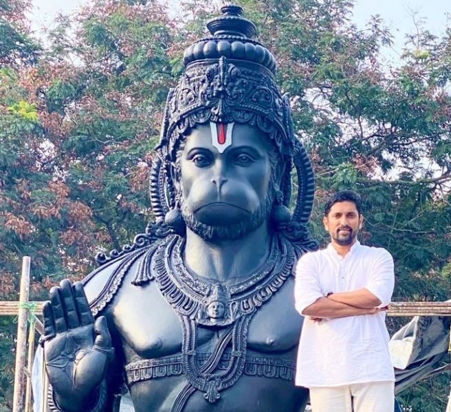 Arun Yogiraj with the 21-foot-tall statue of Lord Hanuman