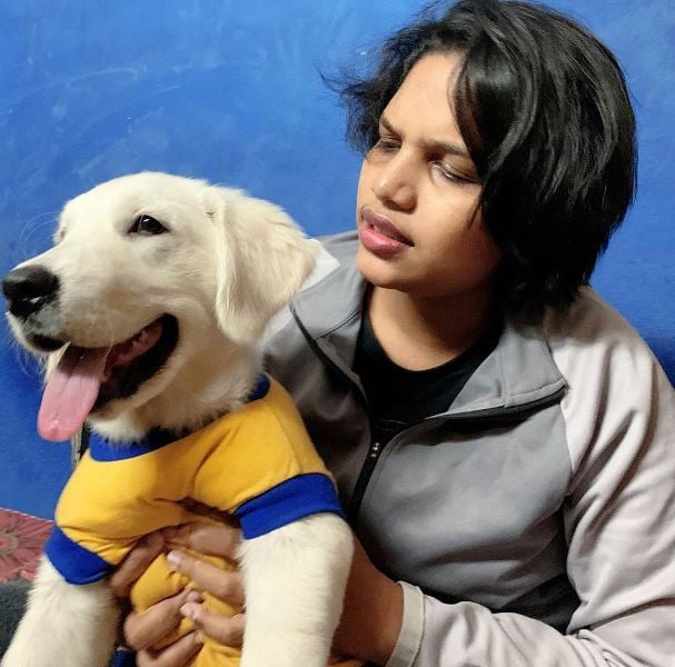 Asha Shobana with her dog