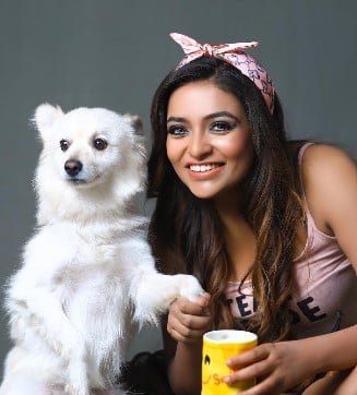 Aashi Roy with her pet dog, Happy