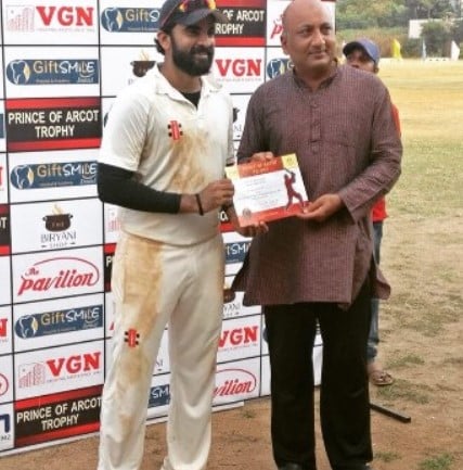 Ashok Selvan while receiving the man of the match certificate