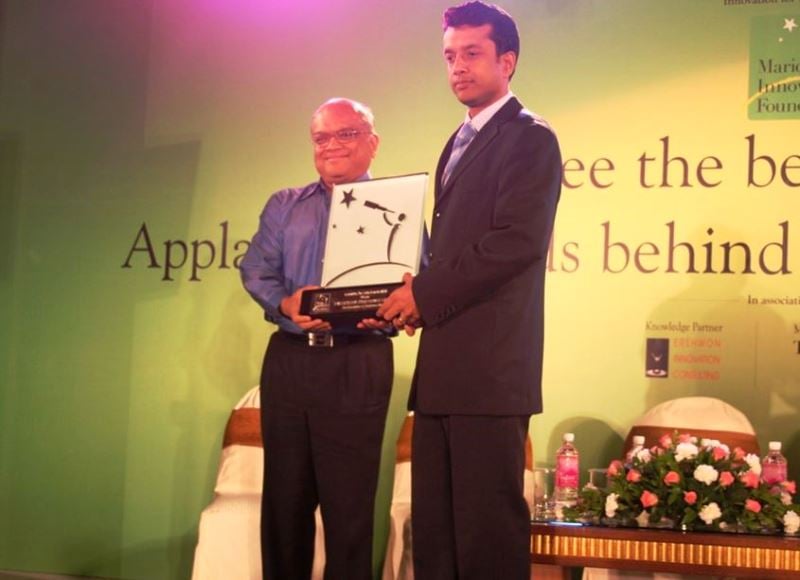 Ashwin Dani (left), Vice Chairman &amp; Managing Director of Asian Paints, presenting an award to Ashish Gupta (right) at an event by Marico Innovation Foundation