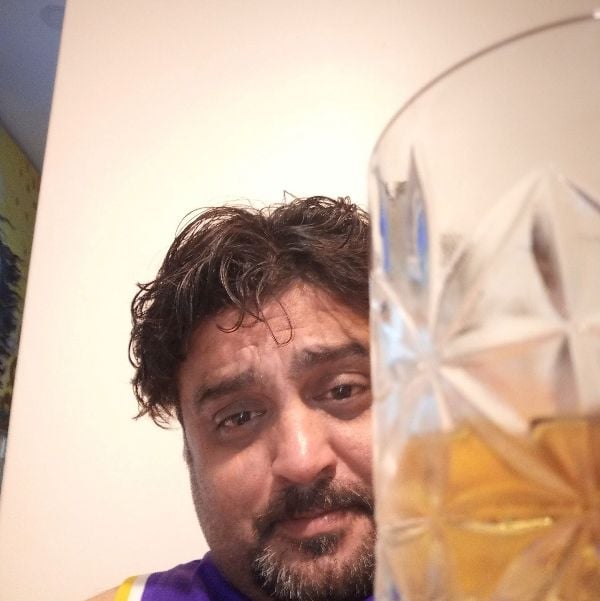 Ashwin Kaushal with his alcohol glass