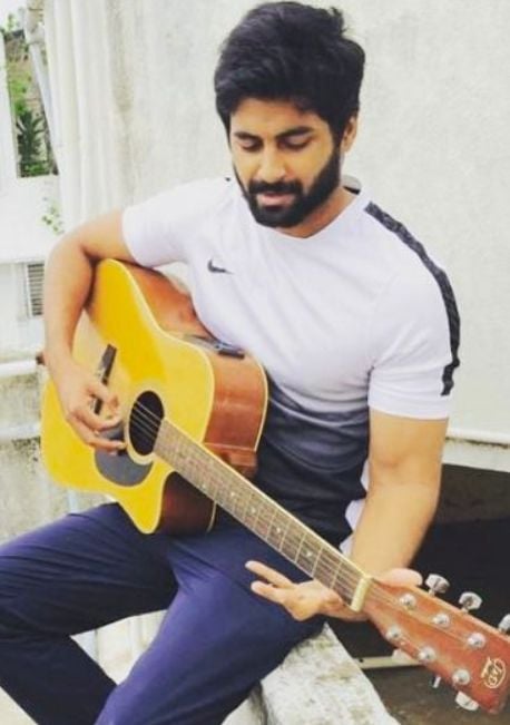 Ashwin kumar lakshmikantha playing guitar