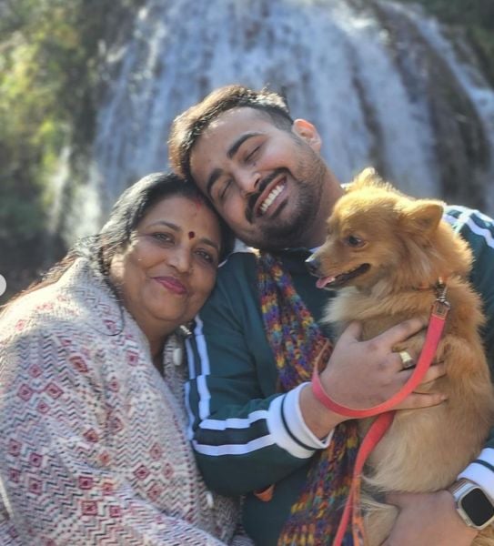 Astro Arun Pandit with his mother and pet dog