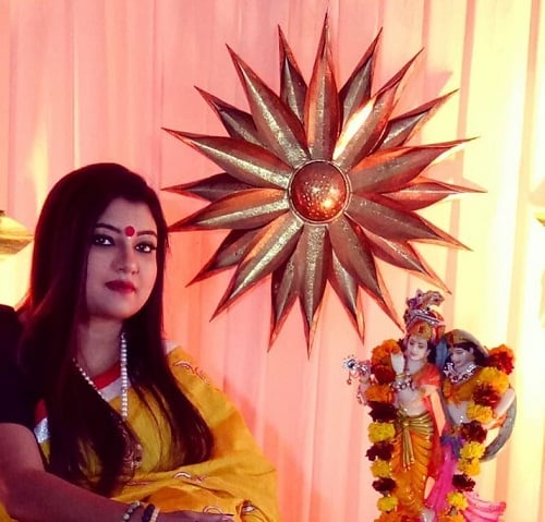 Astro Trishla Chaturvedi with an idol of lord Krishna